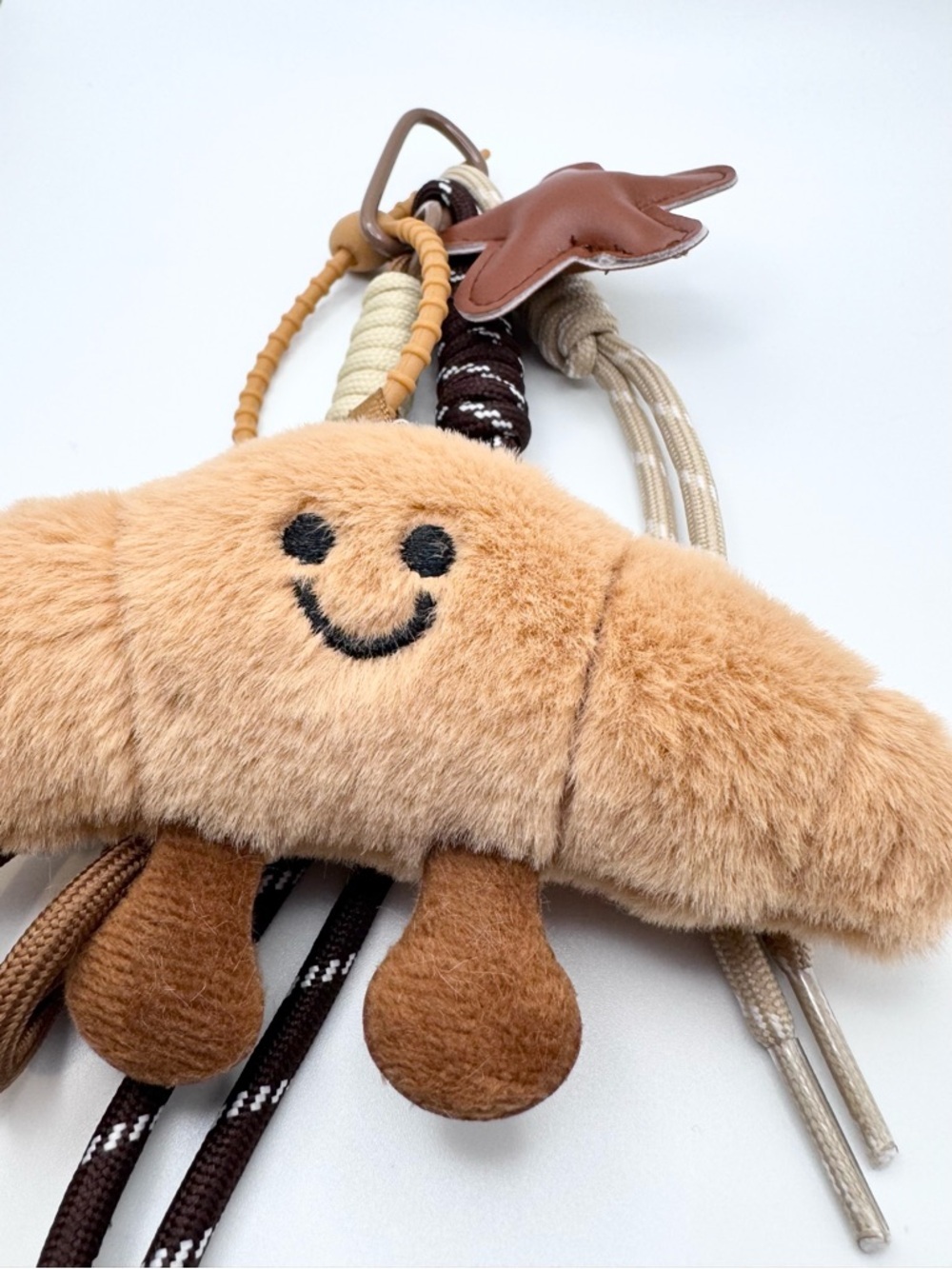 Plush Beige Croissant Bag Keychain Toy – Soft Smiley Accessoryy - Picture 3 of 4